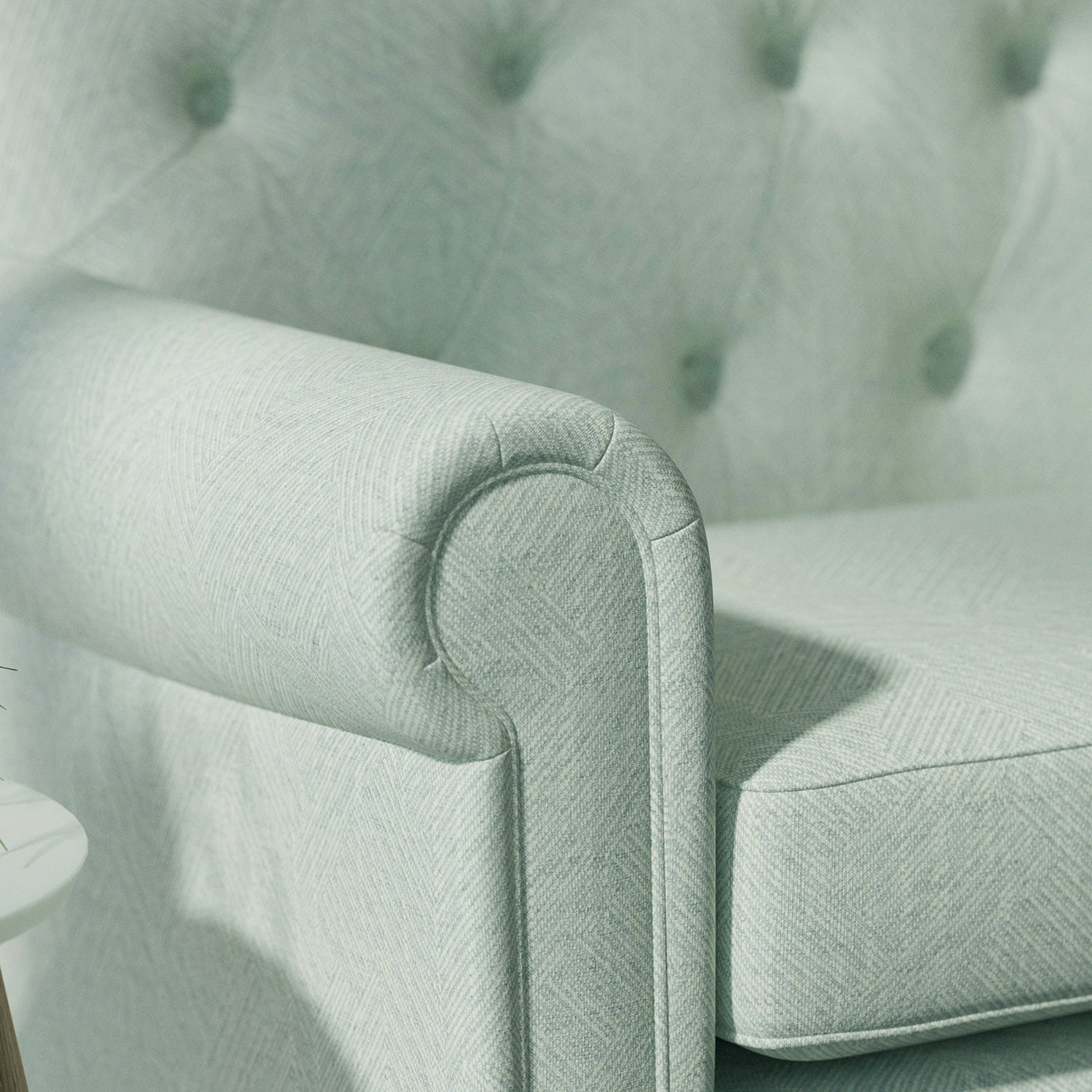 Sofa upholstered in a light blue Scandi-style semi-plain upholstery fabric with a stain resistant finish