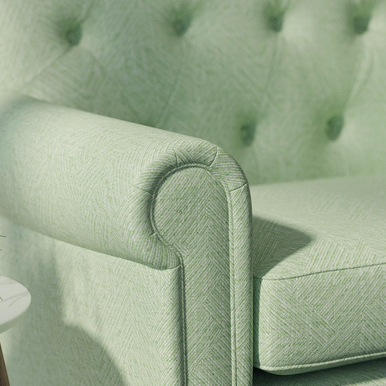 Sofa upholstered in a green Scandi-style semi-plain upholstery fabric with a stain resistant finish