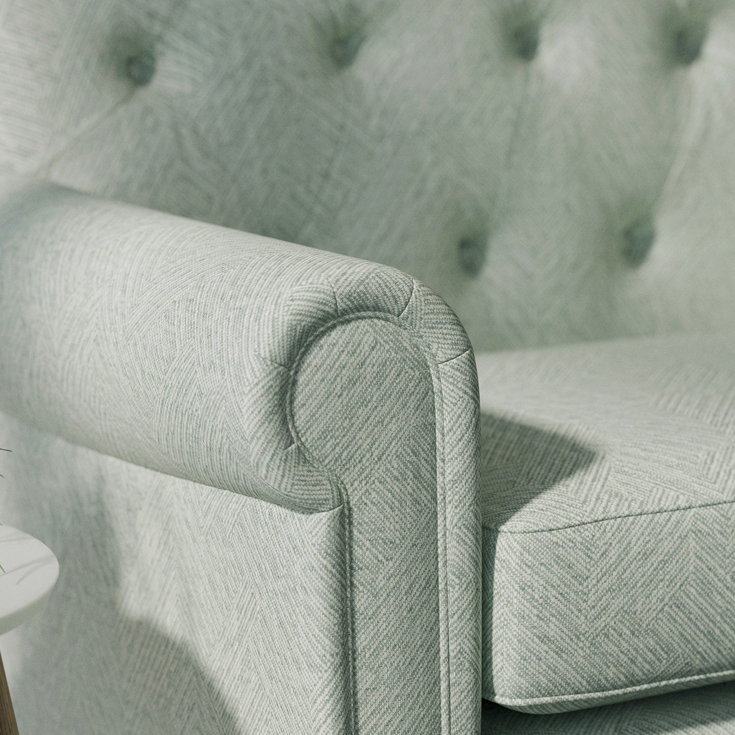 Sofa upholstered in a grey-blue Scandi-style semi-plain upholstery fabric with a stain resistant finish