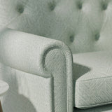 Sofa upholstered in a grey-blue Scandi-style semi-plain upholstery fabric with a stain resistant finish