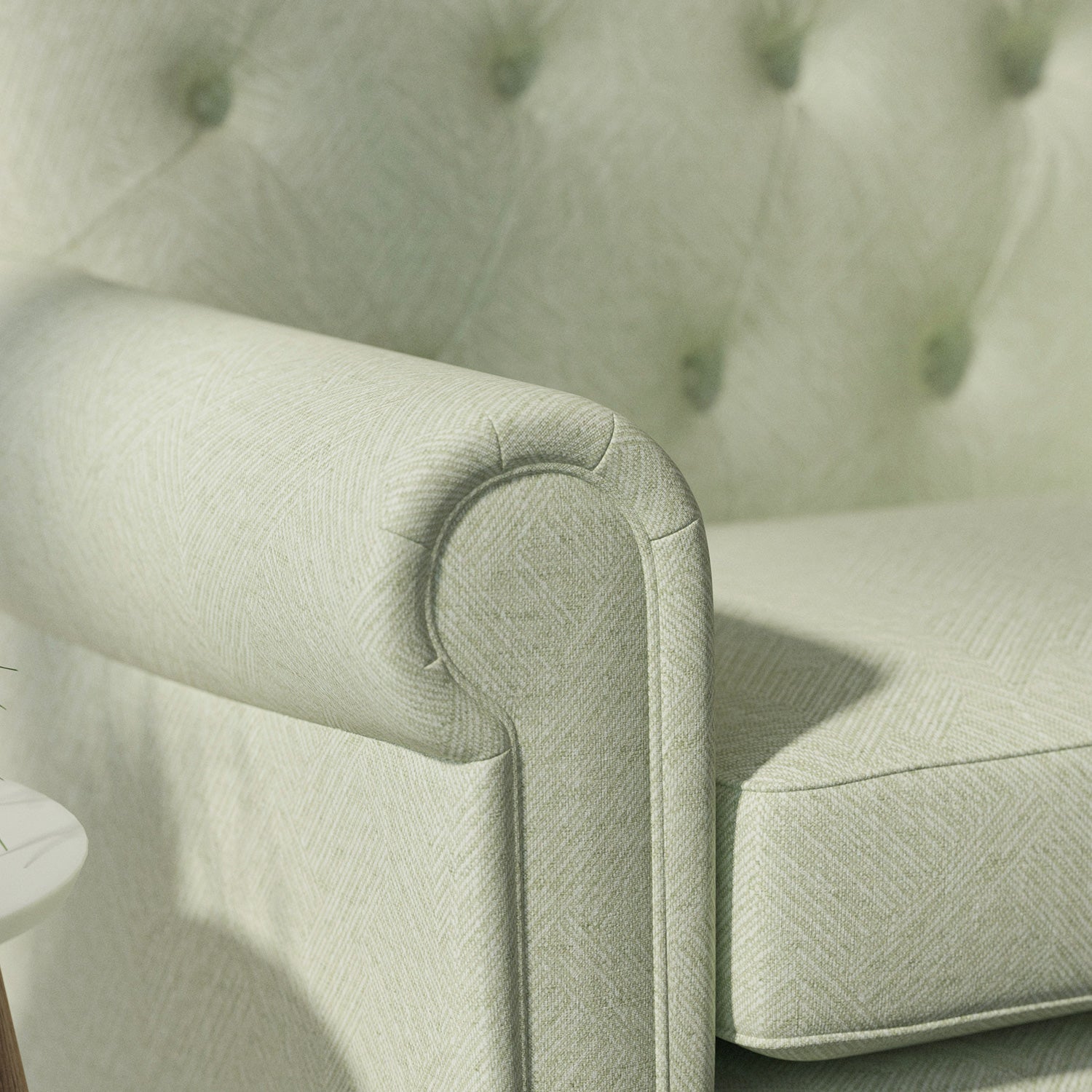 Sofa upholstered in a green Scandi-style semi-plain upholstery fabric with a stain resistant finish