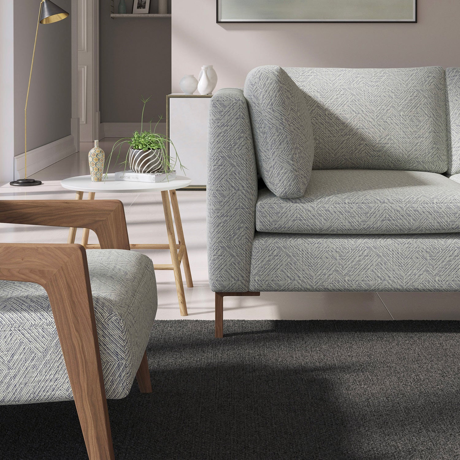 Living room with a contemporary sofa upholstered in a dark blue semi-plain Scandi-style upholstery fabric