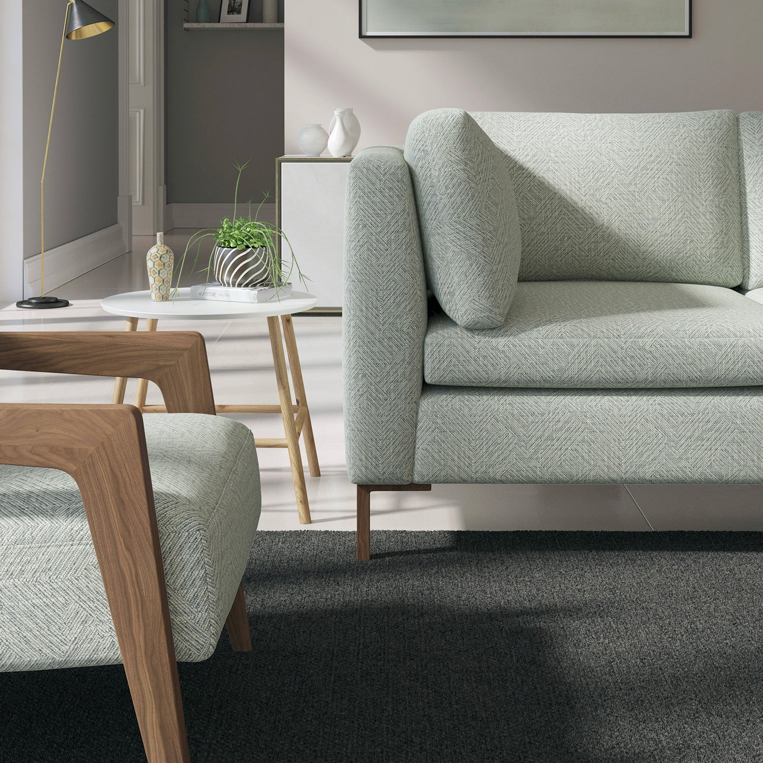 Living room with a contemporary sofa upholstered in a dark grey semi-plain Scandi-style upholstery fabric