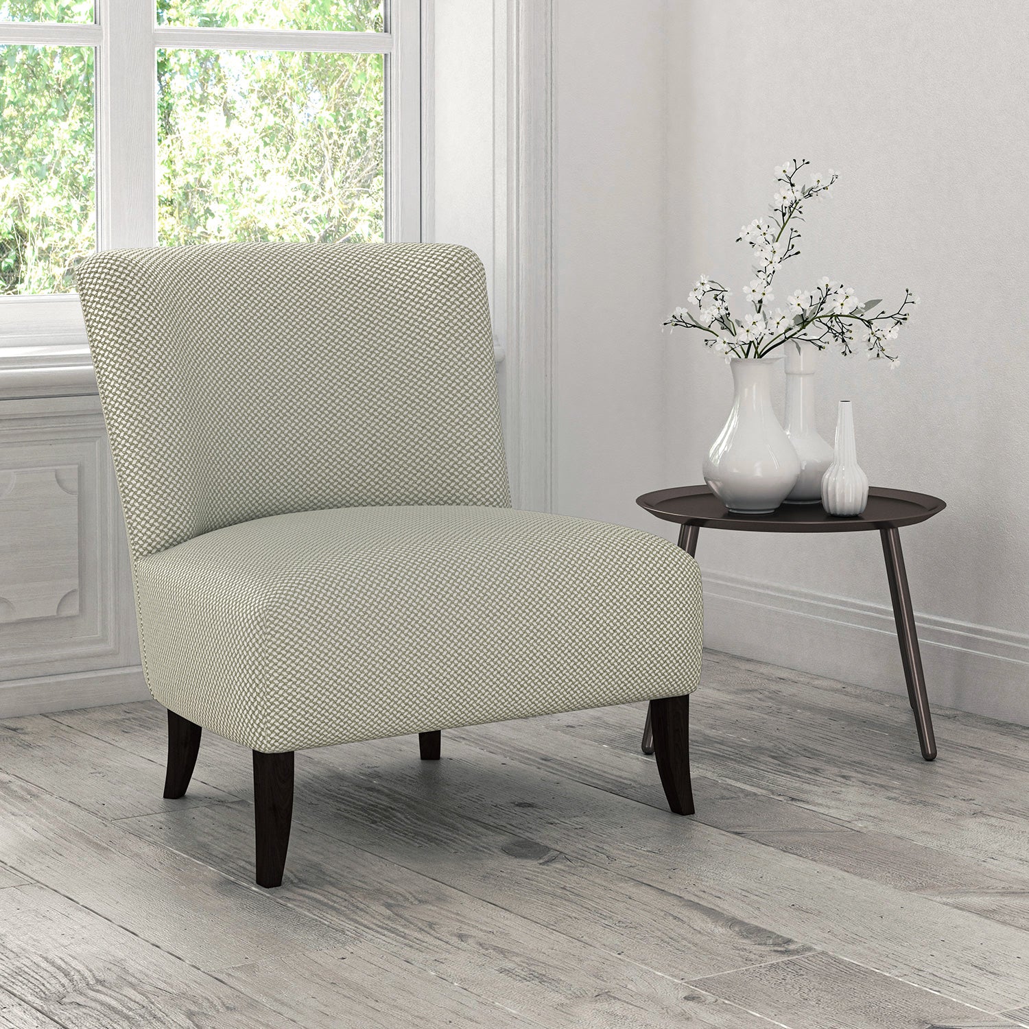 Chair upholstered in a neutral coloured stain resistant geometric weave fabric