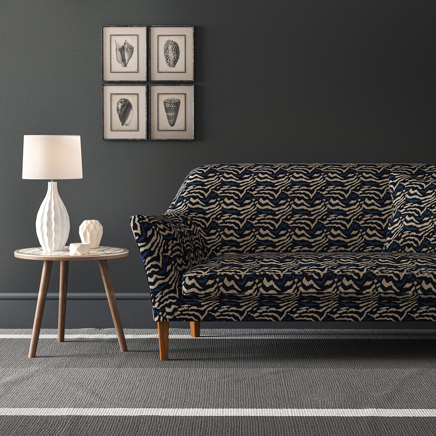Velvet sofa in a dark blue velvet fabric with abstract animal print design