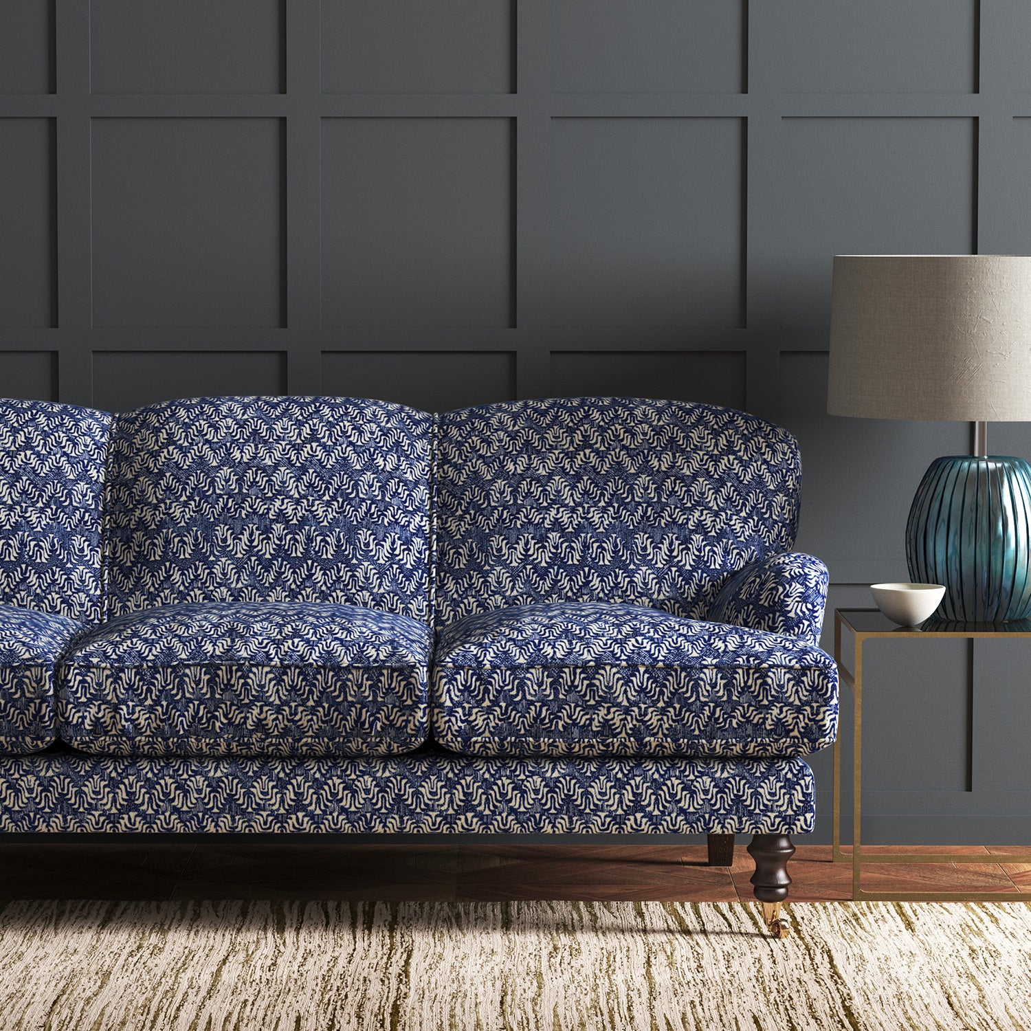 Velvet sofa in a blue velvet fabric with colour block design and stain resistant finish