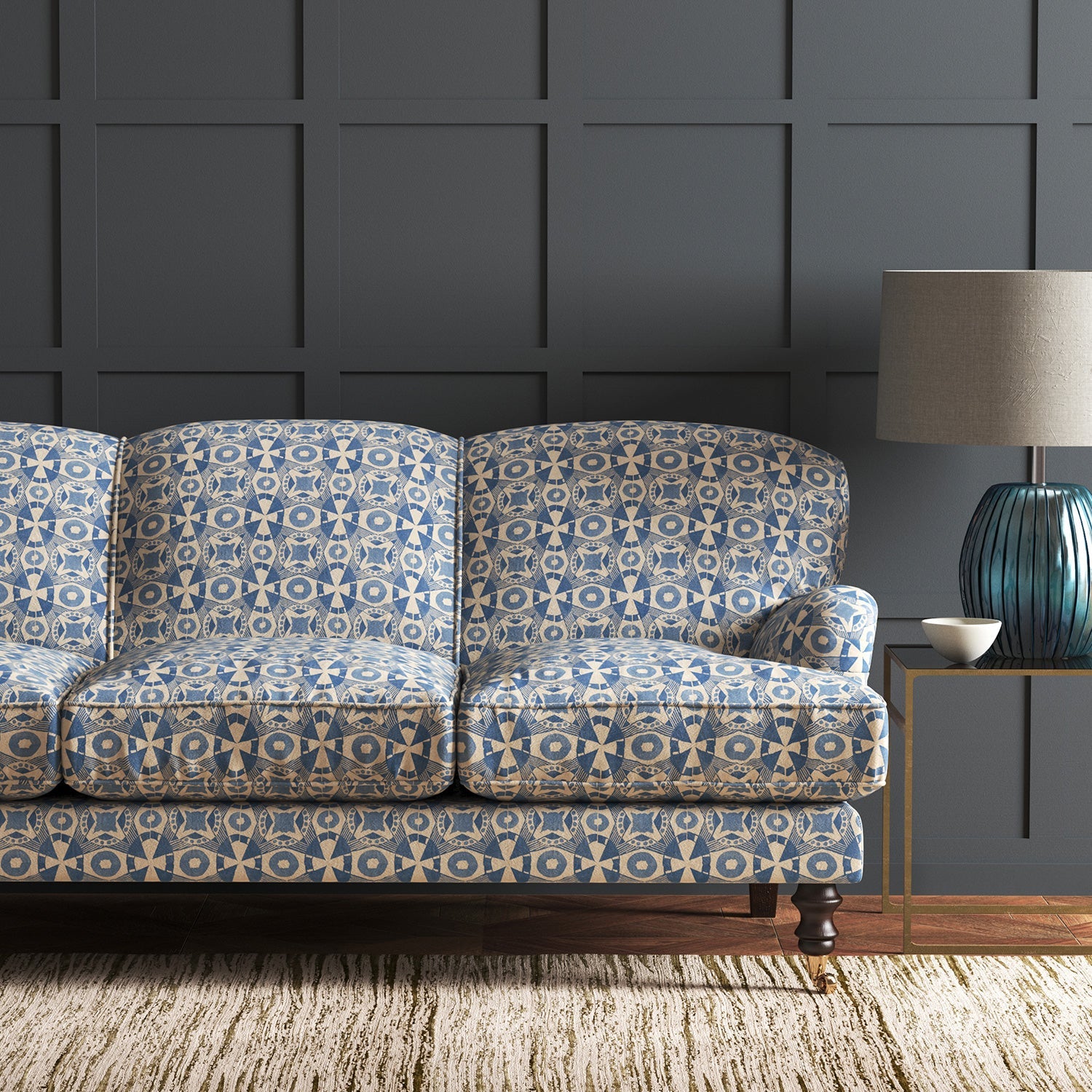 Velvet sofa in a blue velvet fabric with colour block design and stain resistant finish