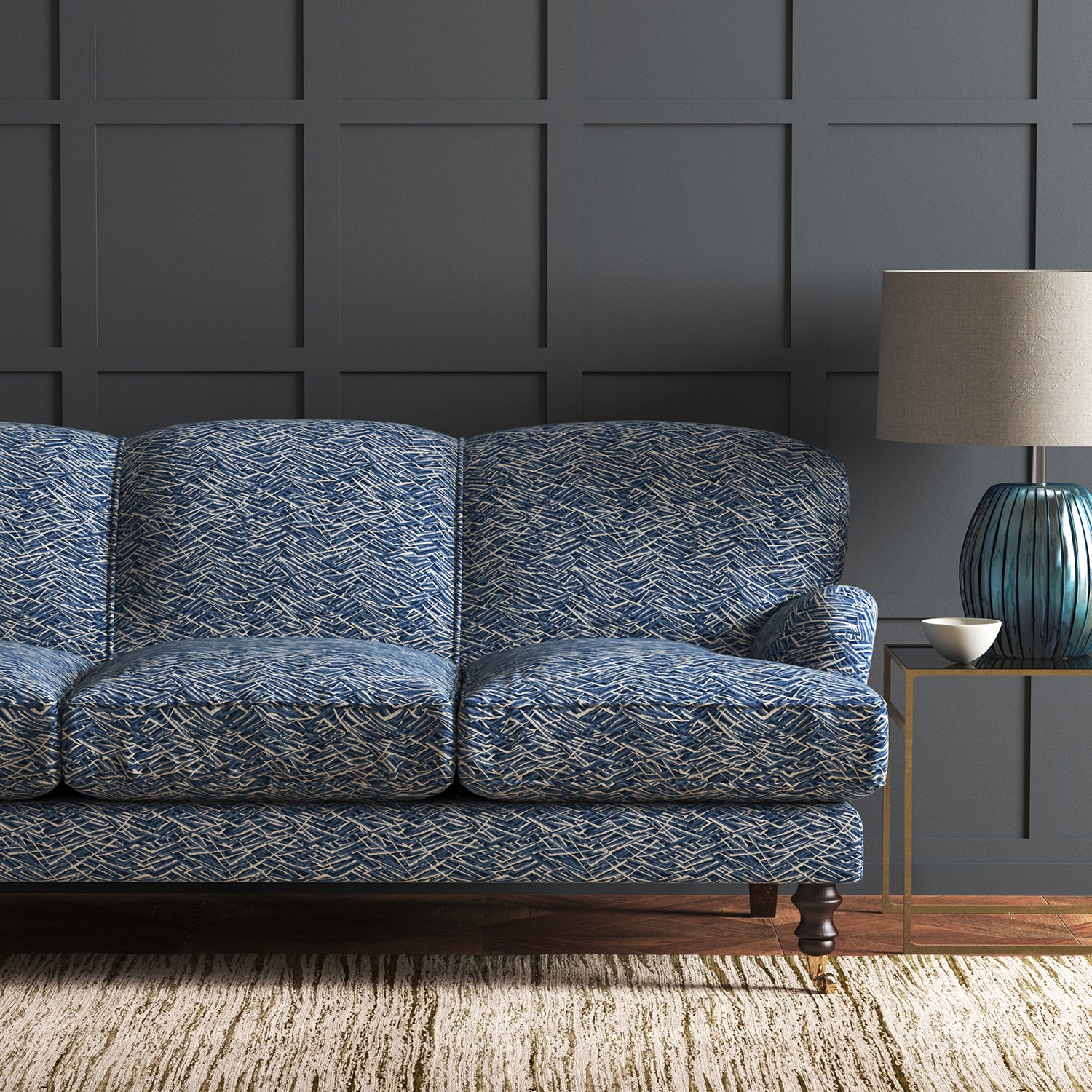 Velvet sofa in a blue velvet sofa with stain resistant finish and abstract design