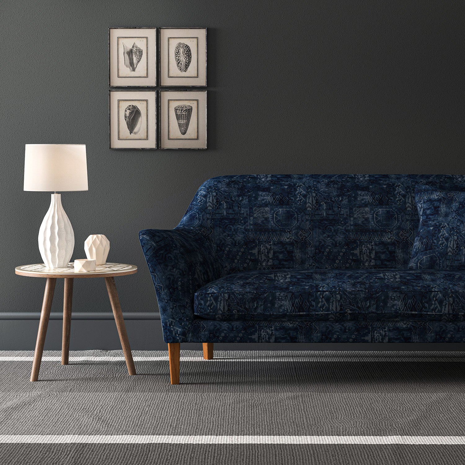 Blue velvet sofa upholstered in a blue velvet fabric with a carpet design and a stain resistant finish