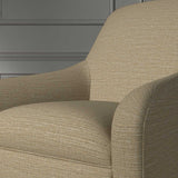 Close up of a chair covered in a woven fabric in a herringbone design in Bisque