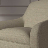 Close up of a chair covered in a woven fabric in a herringbone design in Mushroom