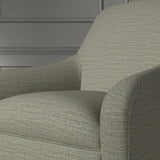 Close up of a chair covered in a woven fabric in a herringbone design in greystone