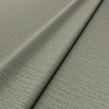 Sample of a woven fabric in a herringbone design in greystone