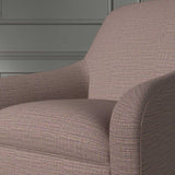 Close up of a chair covered in a woven fabric in a herringbone design in Haze