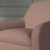 Close up of a chair covered in a woven fabric in a herringbone design in Roseberry