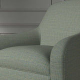 Close up of a chair covered in a woven fabric in a herringbone design in Neptune