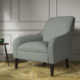 Chair covered in a woven fabric in a herringbone design in Denim