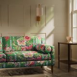 Sofa upholstered in a lively, large scale floral linen fabric