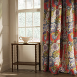 Curtain in a lively, large scale floral linen fabric with orange and lilac tones