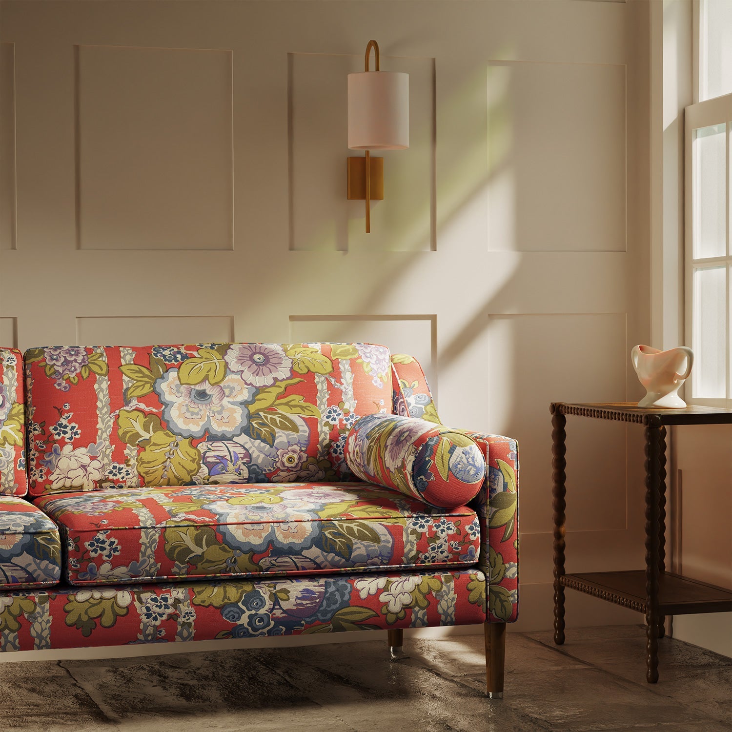 Sofa upholstered in a lively, large scale floral linen fabric with orange and lilac tones