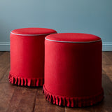 A red woven fabric shown on stools.