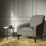 A grey woven fabric on an armchair.