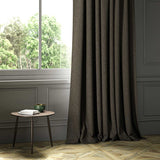 A brown woven fabric shown as a curtain.
