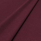 Sample of a red woven fabric in recycled wool.