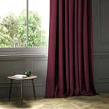 A red woven fabric shown as a curtain.