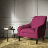 A pink woven fabric on an armchair.