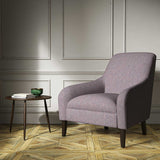 A purple woven fabric on an armchair.