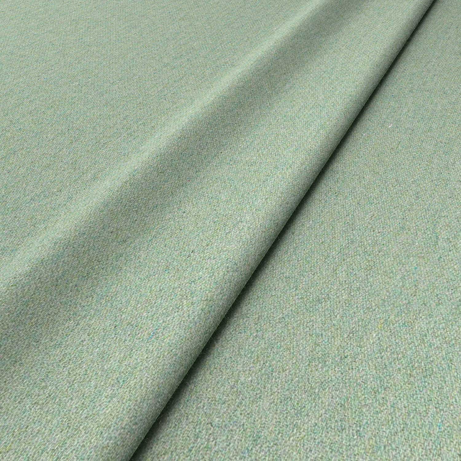 Sample of a green woven fabric in recycled wool.