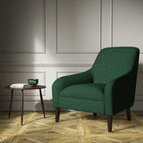 A green woven fabric on an armchair.