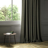A brown woven fabric shown as a curtain.