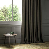 A grey woven fabric on an armchair.