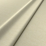Fabric swatch of a cream woven fabric for upholstery