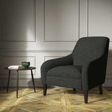 Chair upholstered in a plain black weave fabric