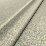 Fabric swatch of cream woven fabric for upholstery