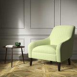Armchair upholstered in a green woven fabric