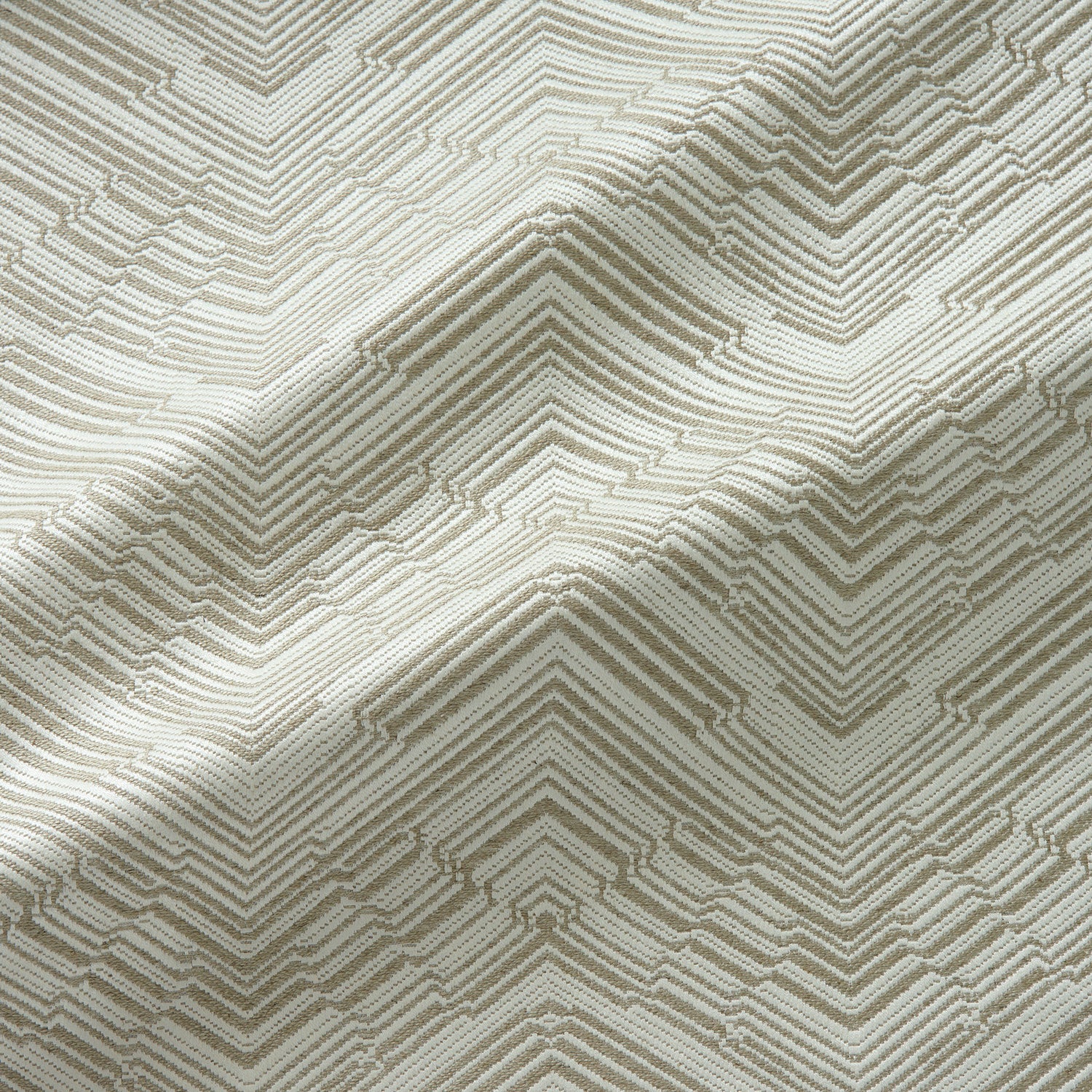 Fabric swatch of a stain resistant herringbone weave design in cream colours, suitable for curtains and upholstery