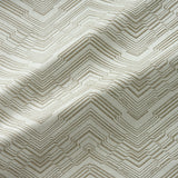 Fabric swatch of a stain resistant herringbone weave design in cream colours, suitable for curtains and upholstery
