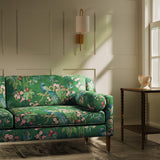 Sofa upholstered in a lively, tropical floral and bird linen fabric
