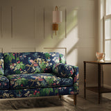 Sofa upholstered in a lively, tropical floral and bird linen fabric
