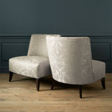 Armchairs in a contemporary damask fabric in a light neutral colour