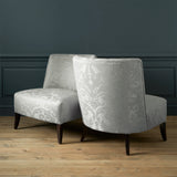 Armchairs in a  a contemporary damask fabric in a cream colour.