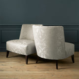 Armchairs in a contemporary damask fabric in a neutral colour.