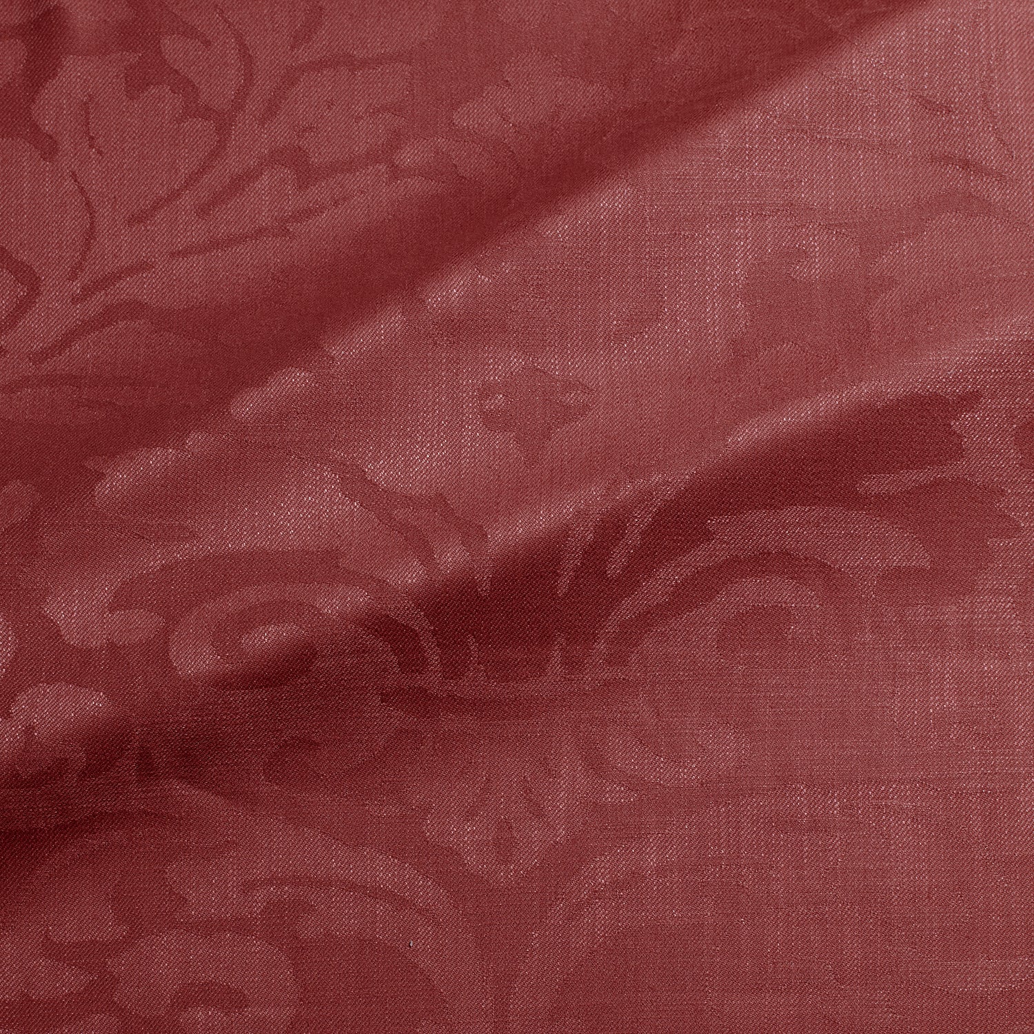 Fabric swatch of a contemporary damask fabric in a burgundy colour for upholstery and curtains.