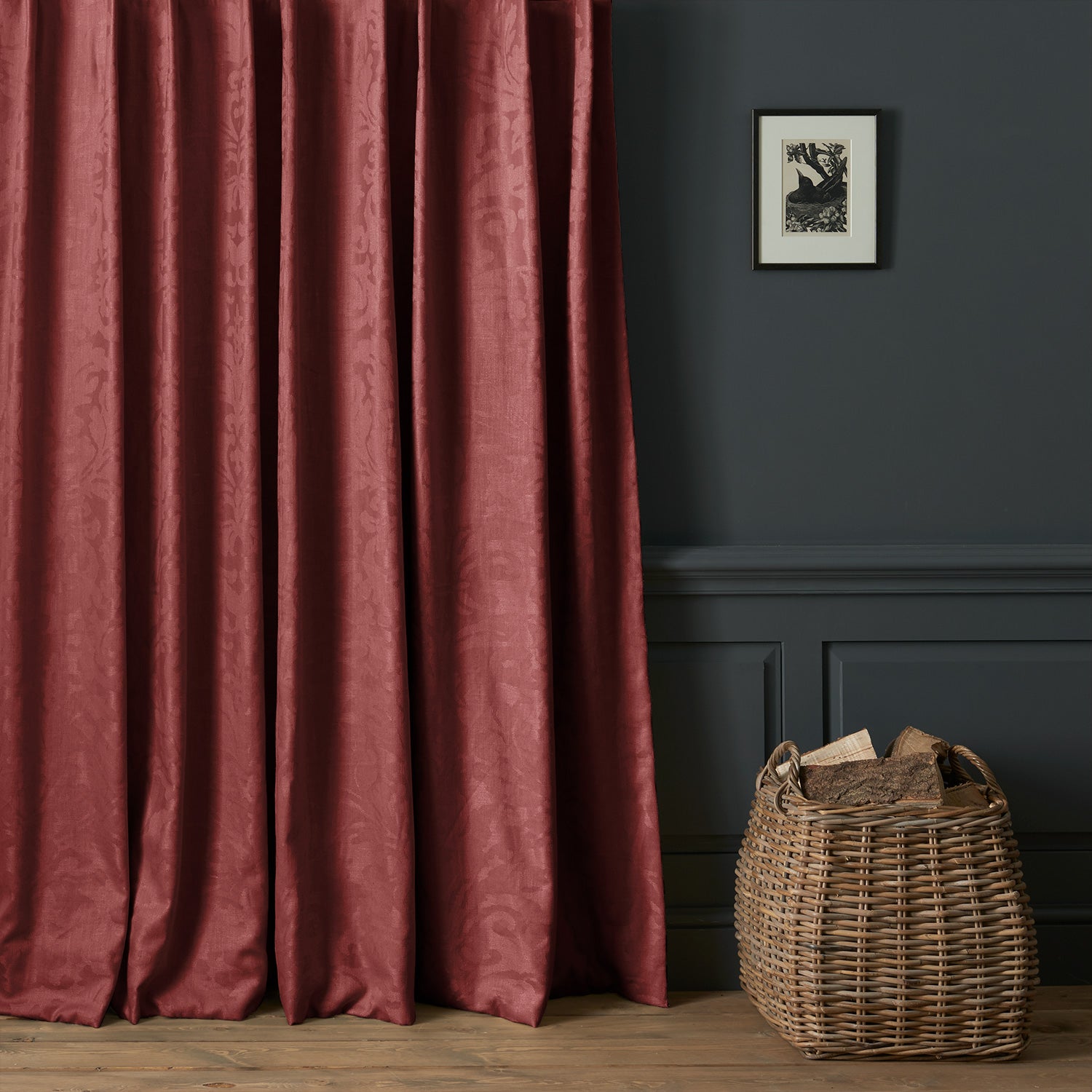 Curtains in a contemporary damask fabric in a burgundy colour.