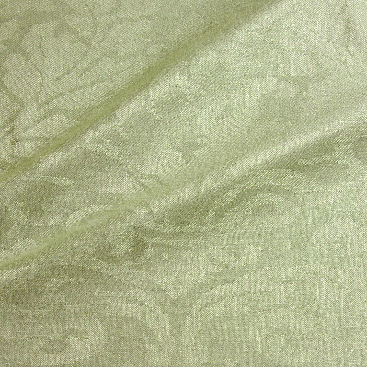 Fabric swatch of a contemporary damask fabric in a light green colour for upholstery and curtains.