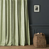 Curtains in a contemporary damask fabric with a light green colours.
